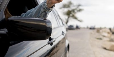 young-woman-enjoying-road-trip